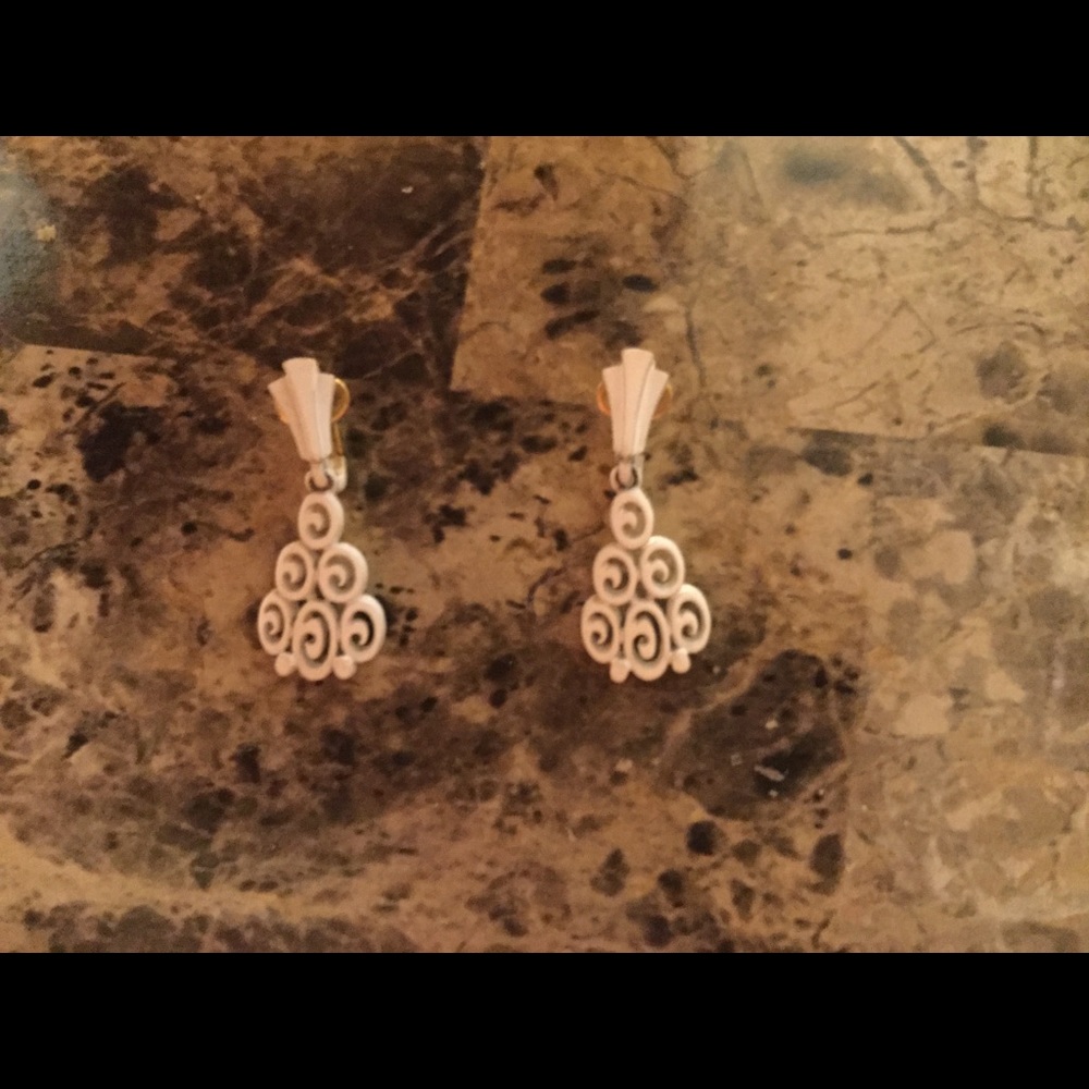 White unusual scroll type earrings